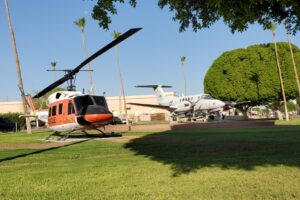 ASM_HQ-1_Front View of HH-1N and UC-12B by HQ building-R