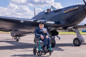 Group_Captain_John_Paddy_Hemingway_in_front_of_a_Hurricane_from_the_Battle_of_Britain_Memorial_Flight